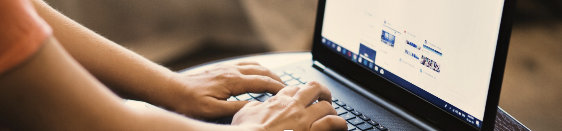 Person searching for a therapist online on a laptop, representing the first step towards counselling support.